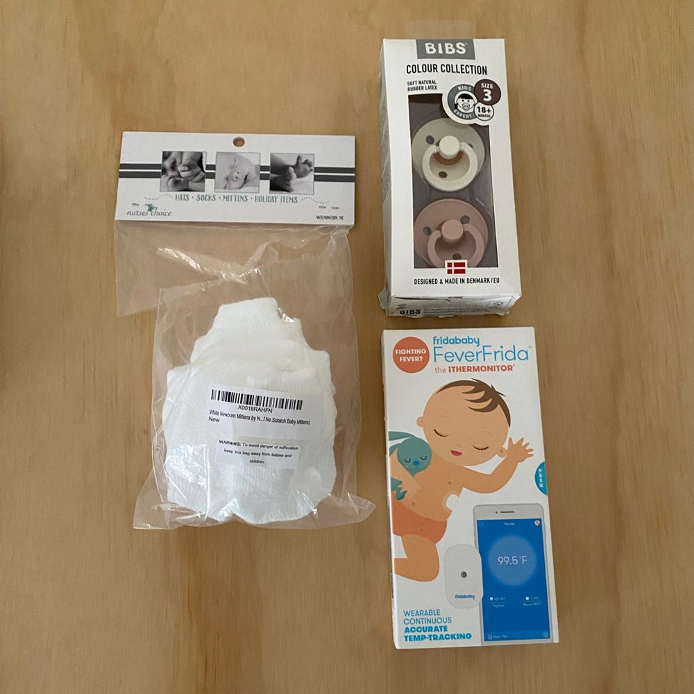 FridaBaby Smart  Blue Tooth Thermometer, Bibs Pacifiers, and Newborn Mittens